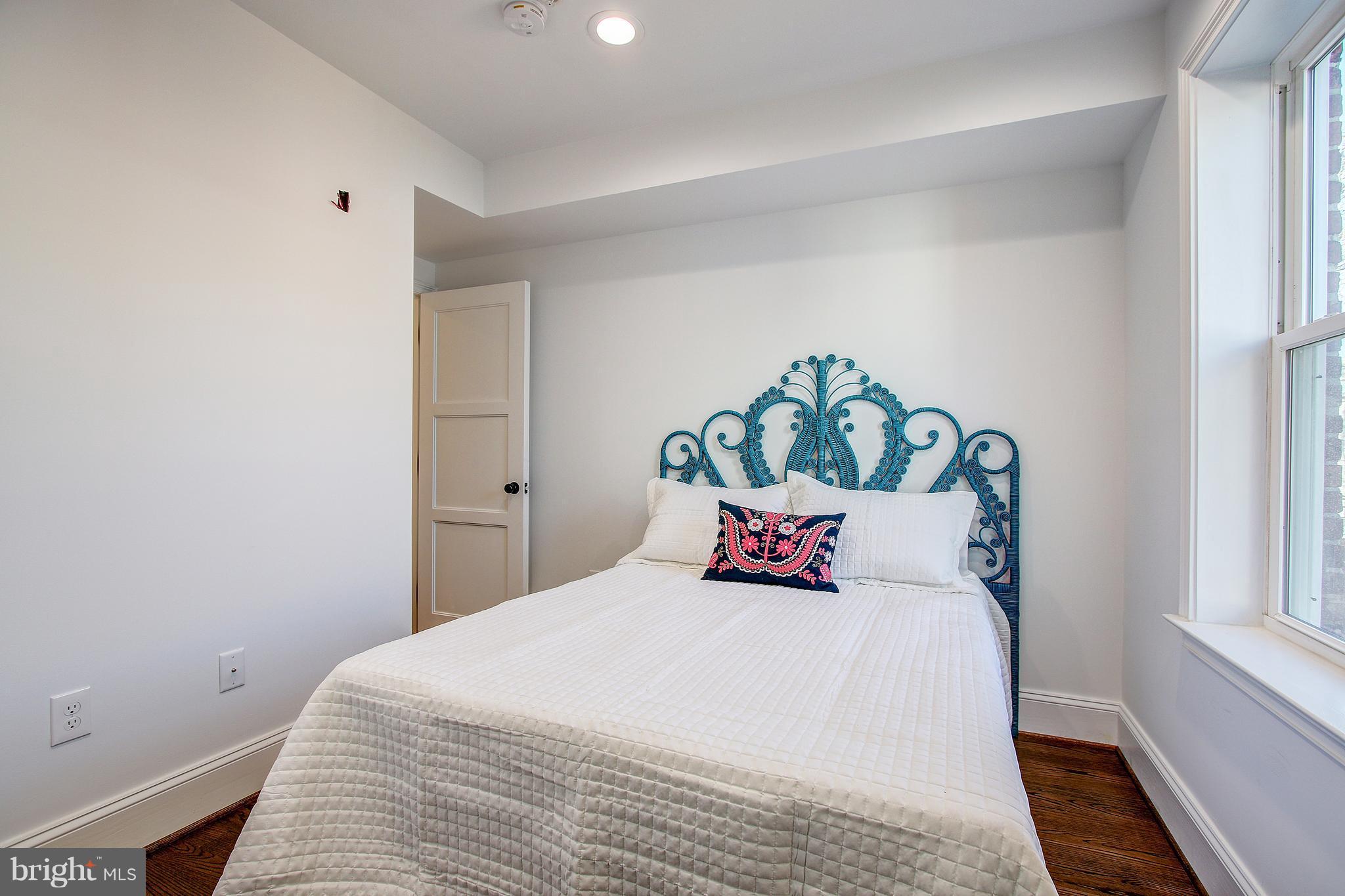 1723 U Street Northwest, Unit 3 Washington, DC 20009 - Photo 20 of 28 a bedroom with a bed and a window
