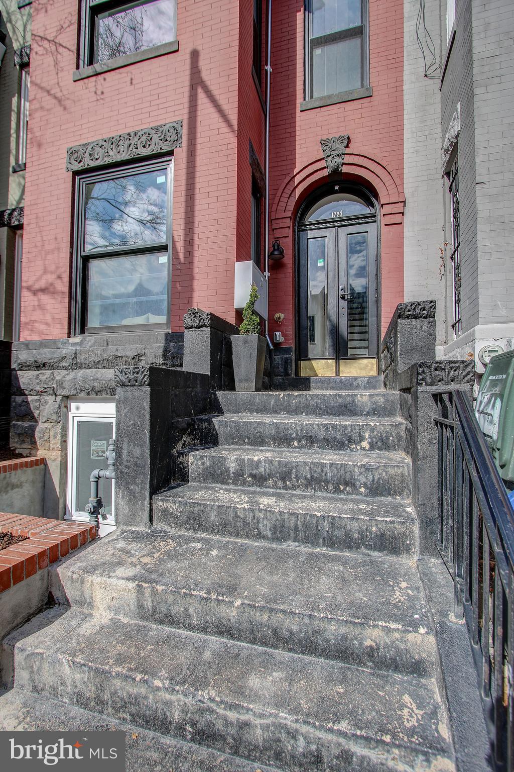 1723 U Street Northwest, Unit 3 Washington, DC 20009 - Photo 22 of 28 a front view of a house with a porch