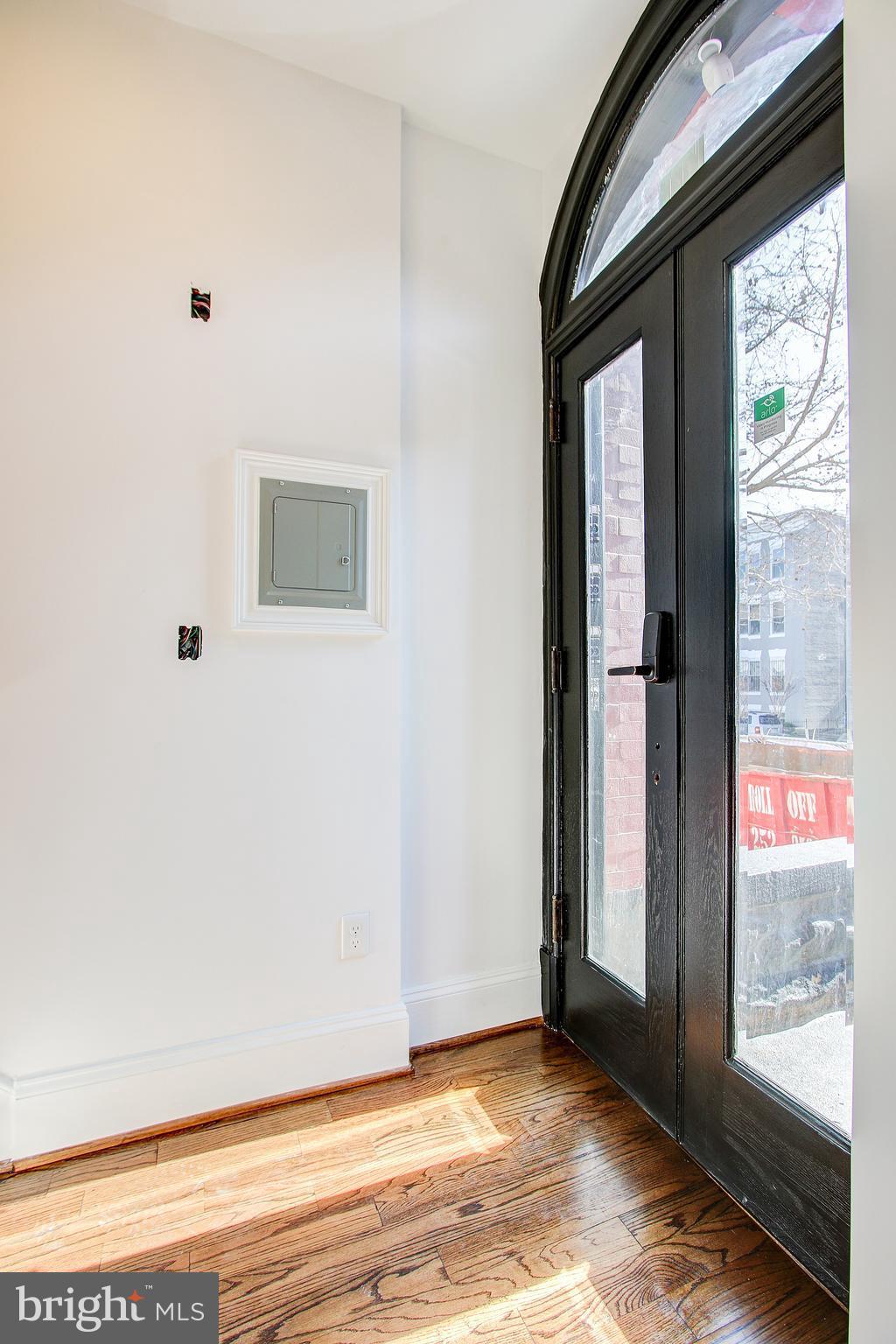 1723 U Street Northwest, Unit 3 Washington, DC 20009 - Photo 24 of 28 a view of an empty room with wooden floor and a window