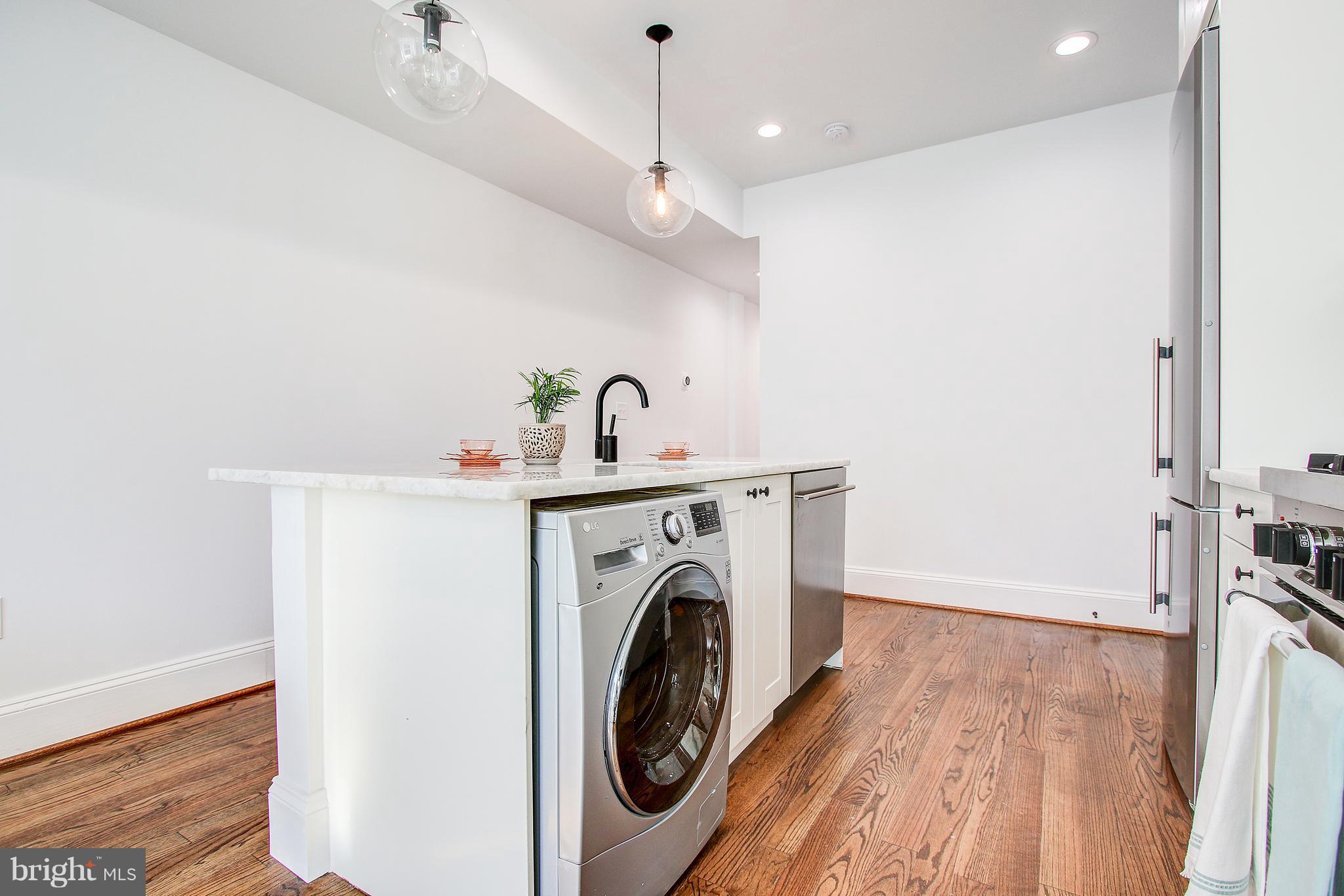 1723 U Street Northwest, Unit 3 Washington, DC 20009 - Photo 6 of 28 a view of livingroom with washer and dryer
