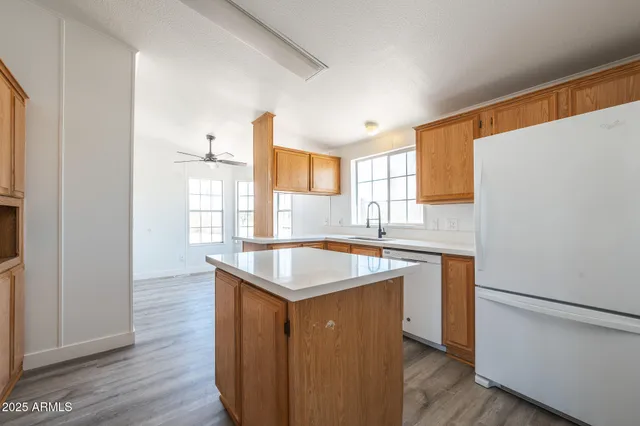 a kitchen with a sink stove and refrigerator