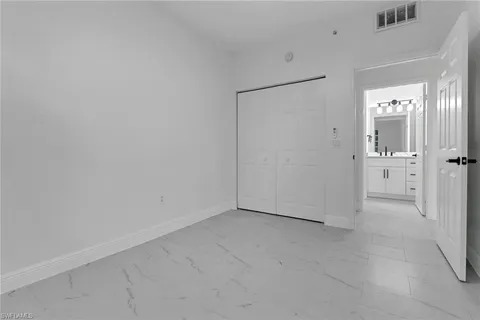 an empty room with a bathroom