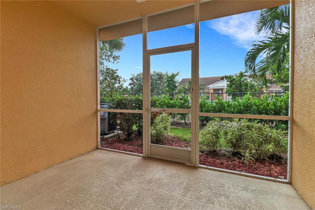 20170 Estero Gardens Circle, Unit 107 Estero, FL 33928 - Photo 25 of 44 an empty room with balcony and outdoor space