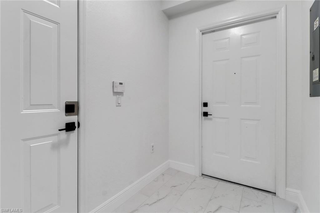 20170 Estero Gardens Circle, Unit 107 Estero, FL 33928 - Photo 3 of 44 a bathroom with a shower