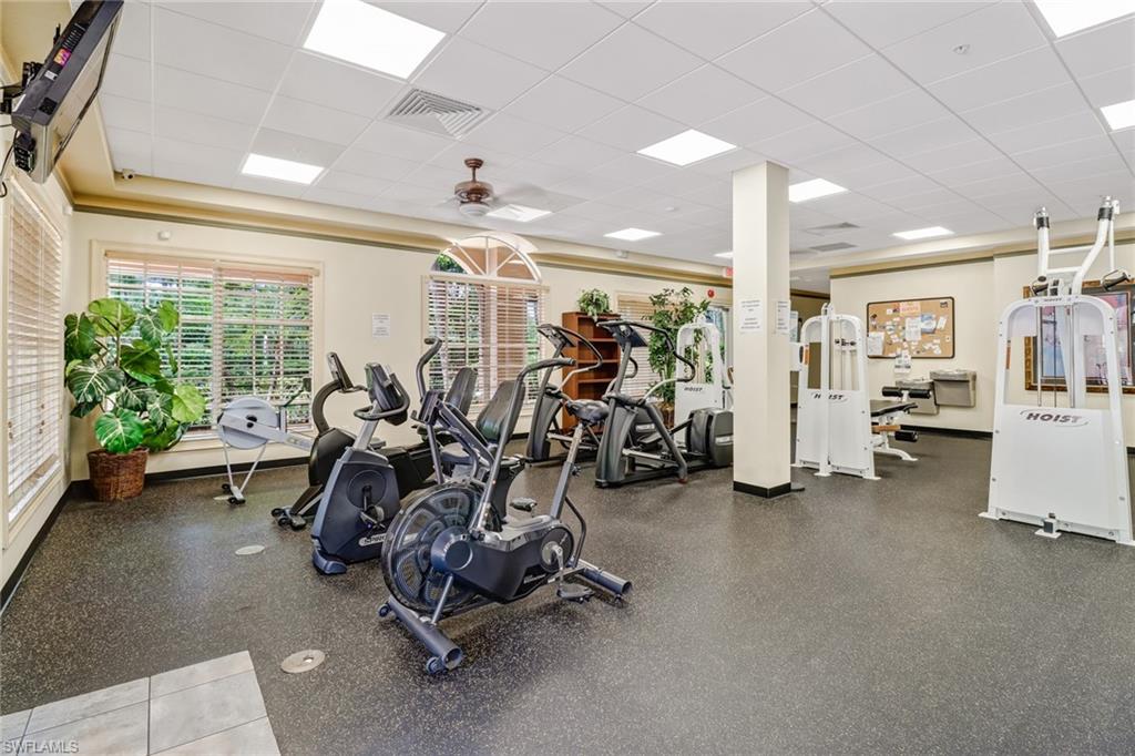 20170 Estero Gardens Circle, Unit 107 Estero, FL 33928 - Photo 40 of 44 a view of a room with gym equipment