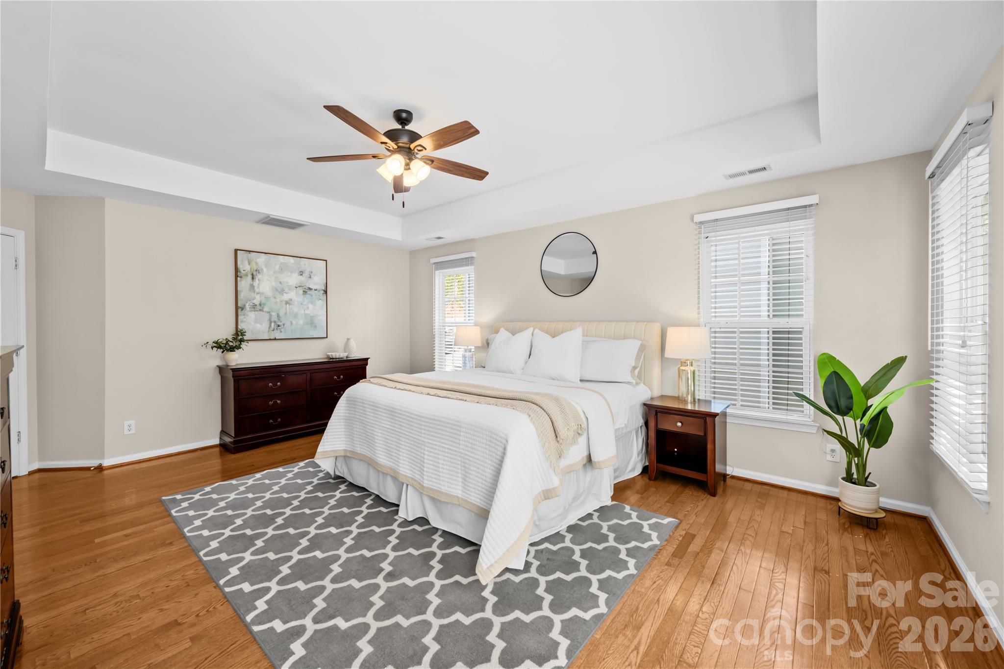 13338 Fremington Road Huntersville, NC 28078 - Photo 21 of 34 a bedroom with a bed and a chandelier