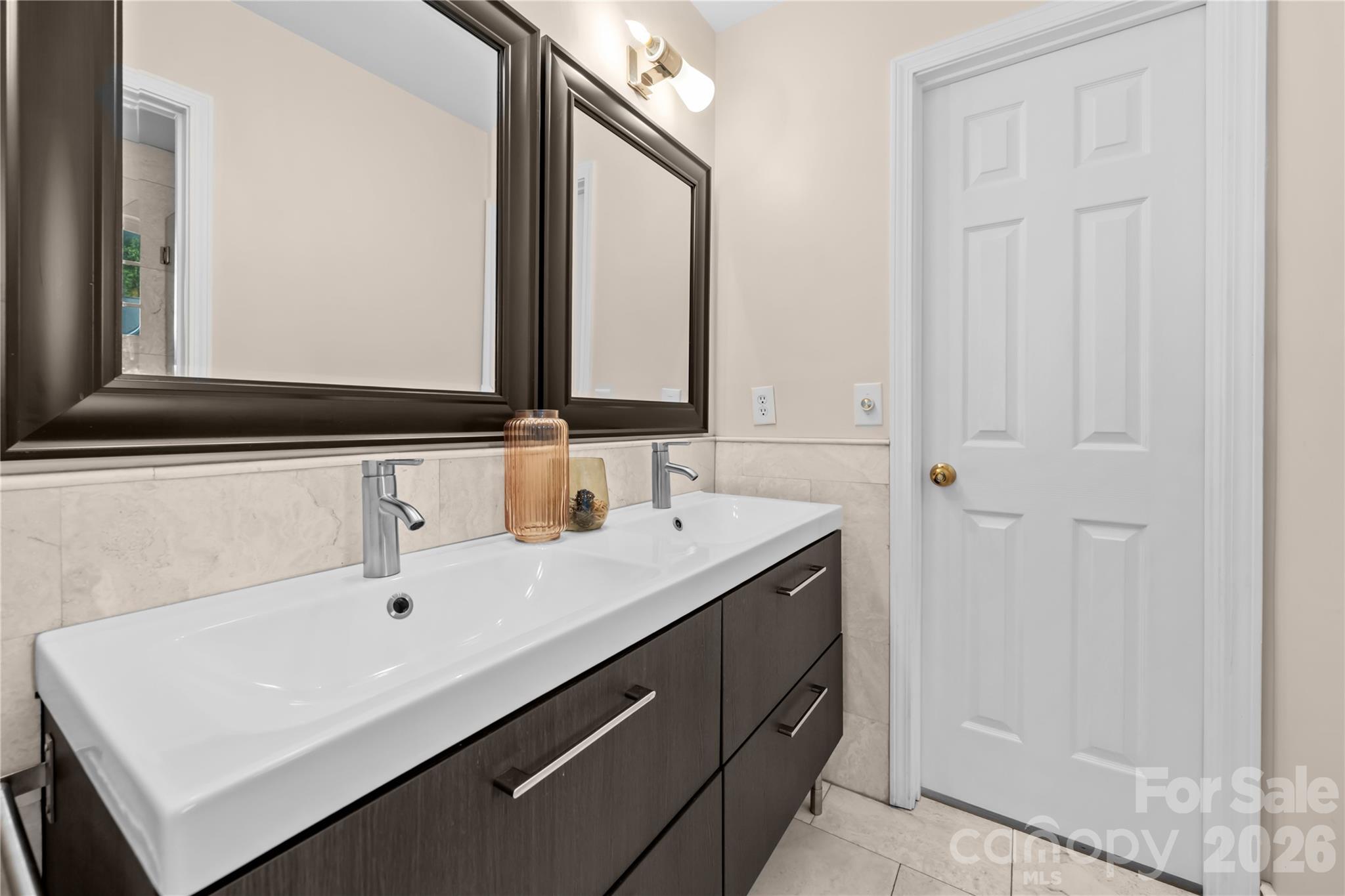 13338 Fremington Road Huntersville, NC 28078 - Photo 26 of 34 a bathroom with a sink and a mirror