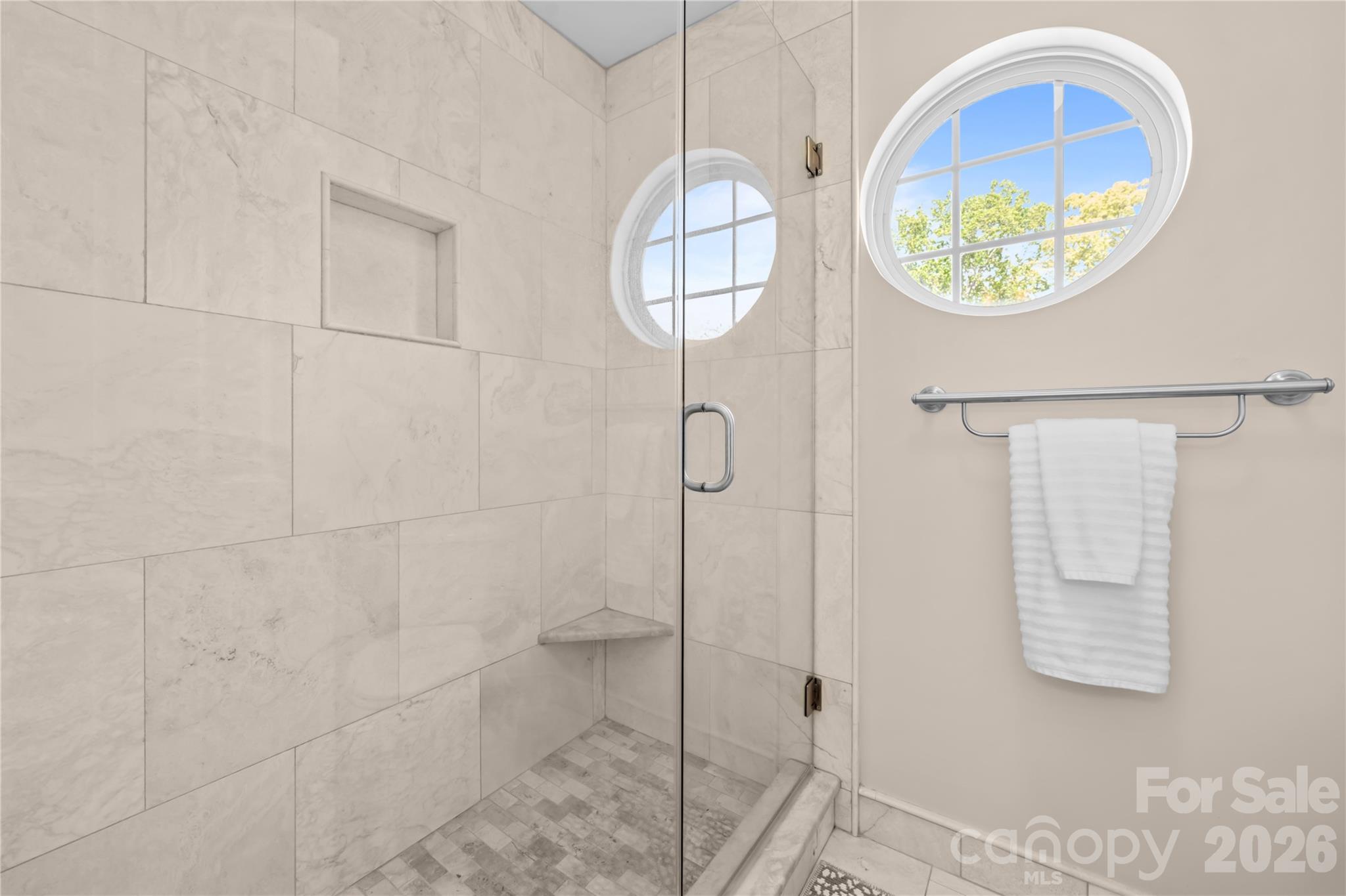 13338 Fremington Road Huntersville, NC 28078 - Photo 27 of 34 a bathroom with a mirror and a shower