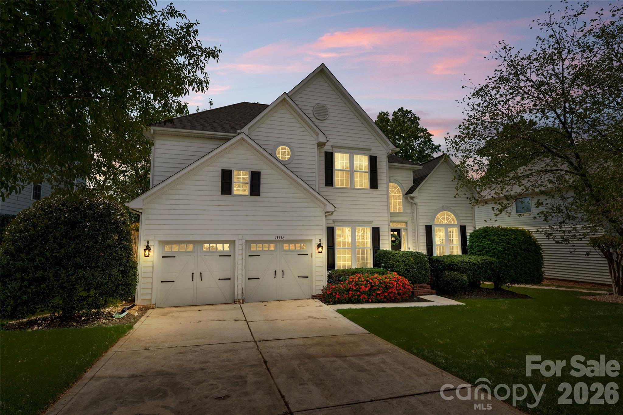 13338 Fremington Road Huntersville, NC 28078 - Photo 4 of 34 a front view of a house with garden