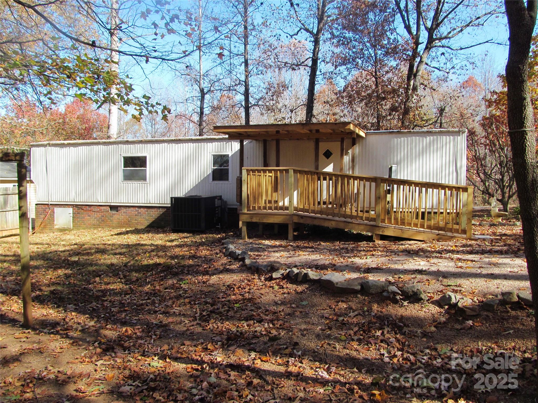 1054 Stirewalt Road, Unit 6 China Grove, NC 28023 - Photo 1 of 10 a front view of a house with a yard