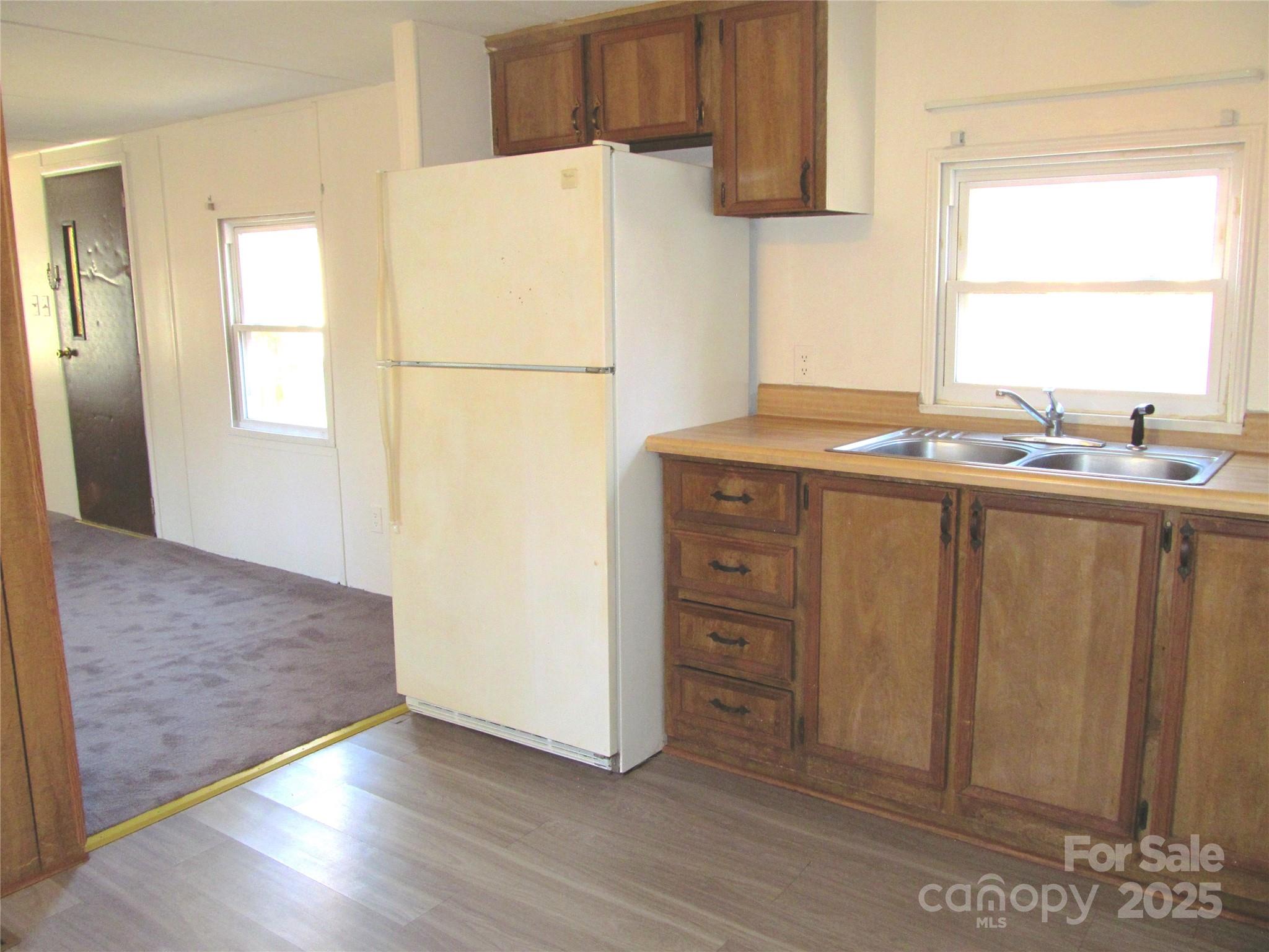 1054 Stirewalt Road, Unit 6 China Grove, NC 28023 - Photo 2 of 10 a kitchen with a refrigerator and a sink