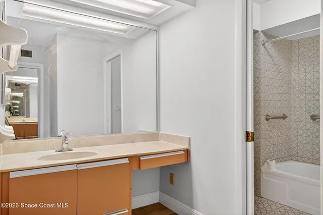 a bathroom with a sink and a bathtub