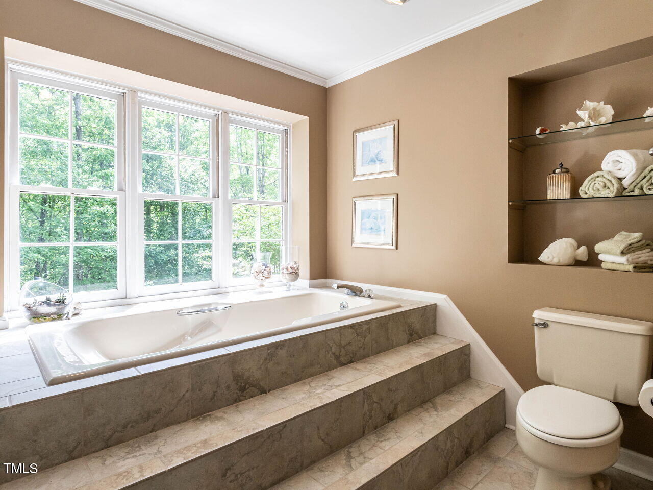 5317 Deep Valley Raleigh, NC 27606 - Photo 8 of 59 a spacious bathroom with a granite countertop toilet a sink and a large mirror