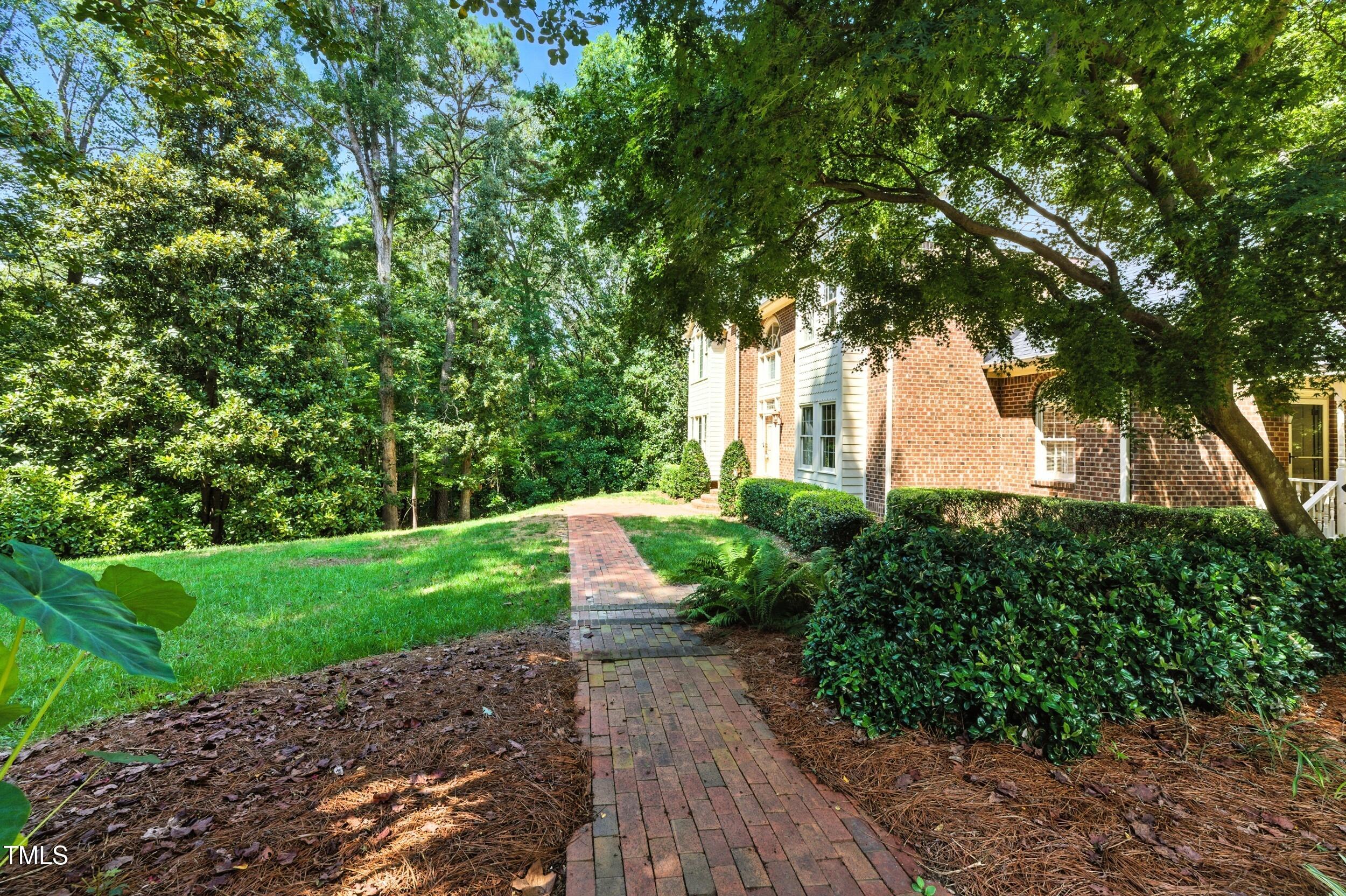 5317 Deep Valley Raleigh, NC 27606 - Photo 12 of 59 a view of a garden with large trees