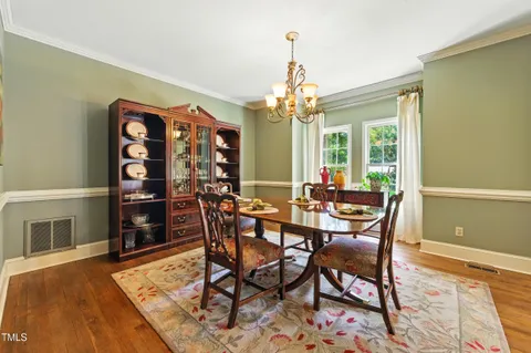 a living room with furniture fireplace and window