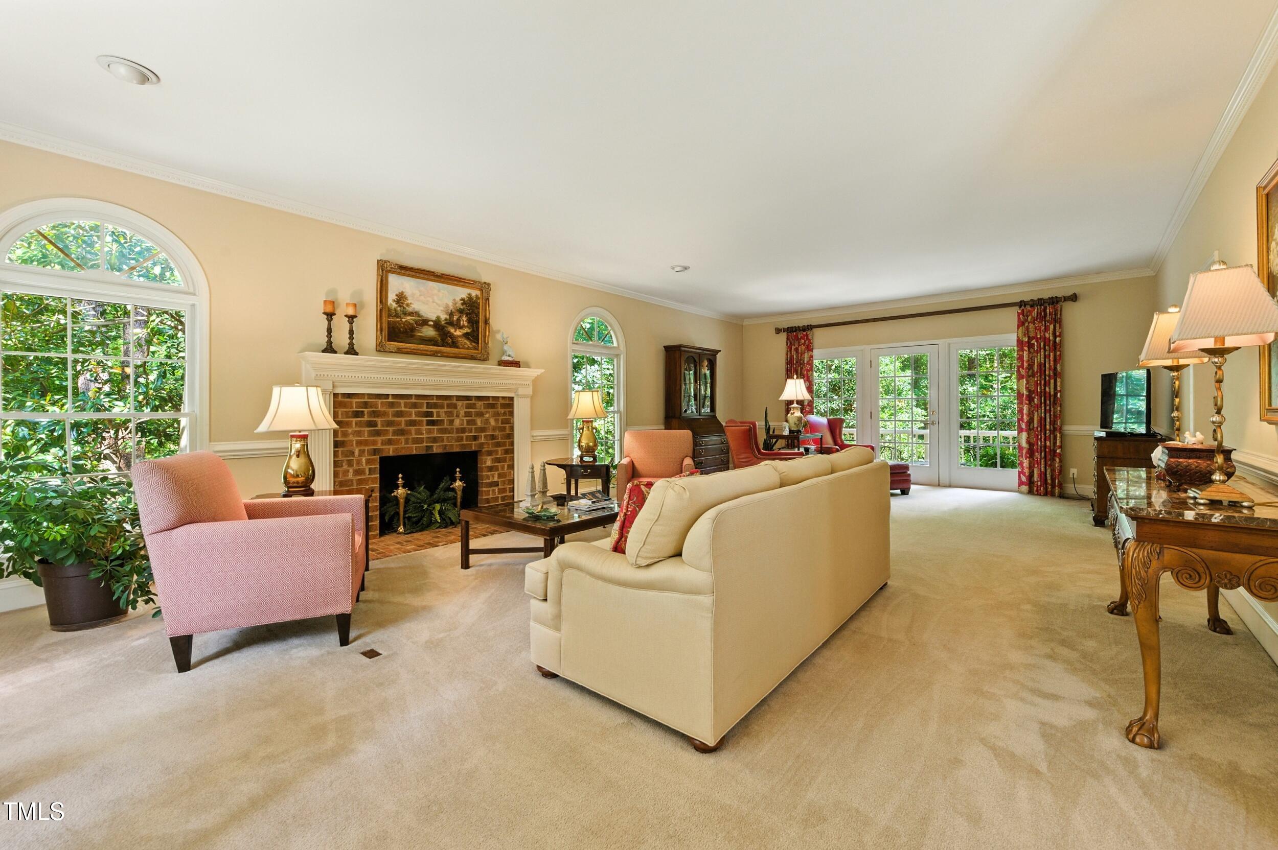 5317 Deep Valley Raleigh, NC 27606 - Photo 18 of 59 a living room with furniture and a fireplace