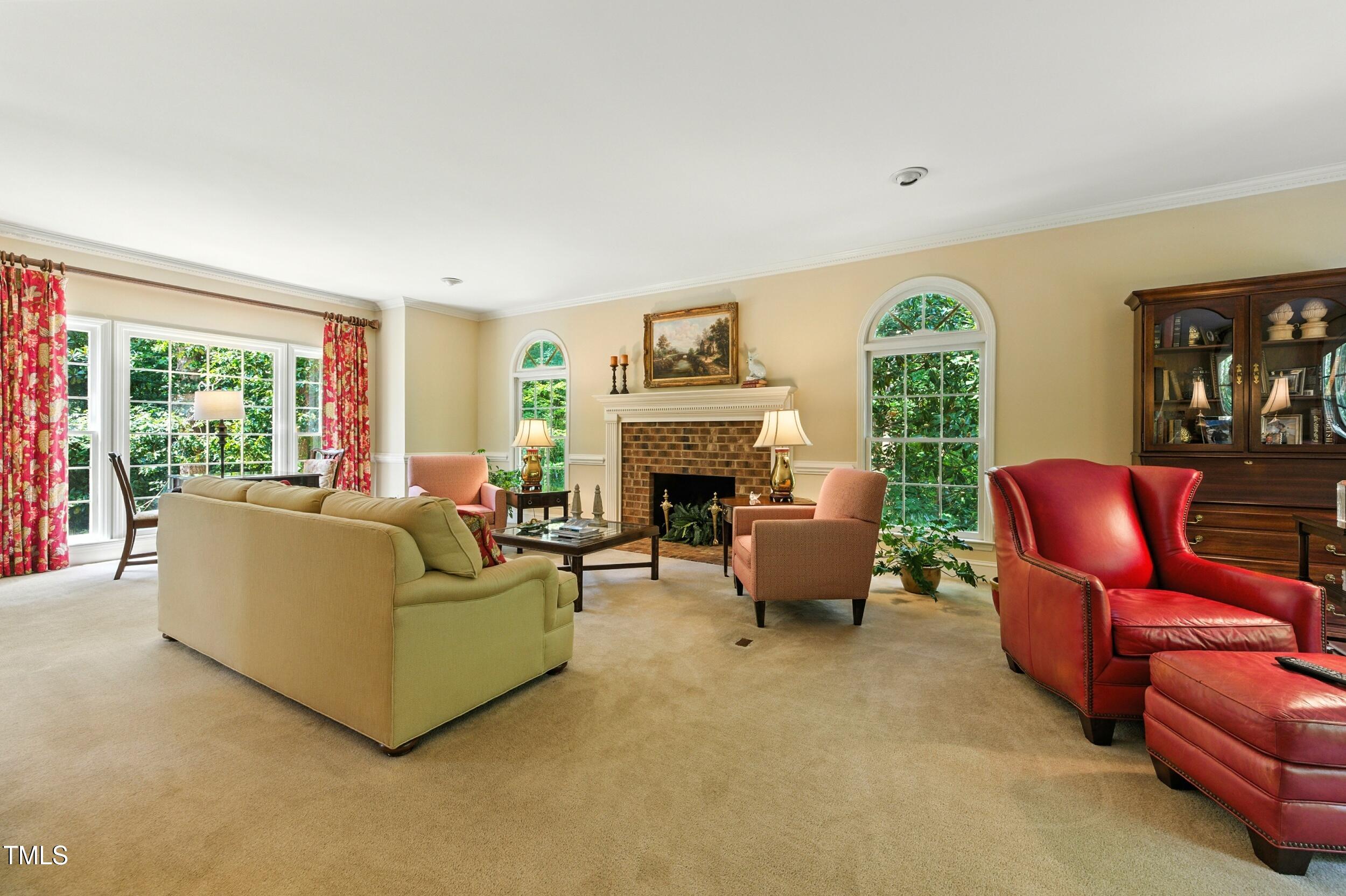 5317 Deep Valley Raleigh, NC 27606 - Photo 20 of 59 a living room with furniture and a fireplace