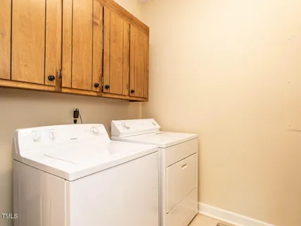 a view of a house with a yard and a garden