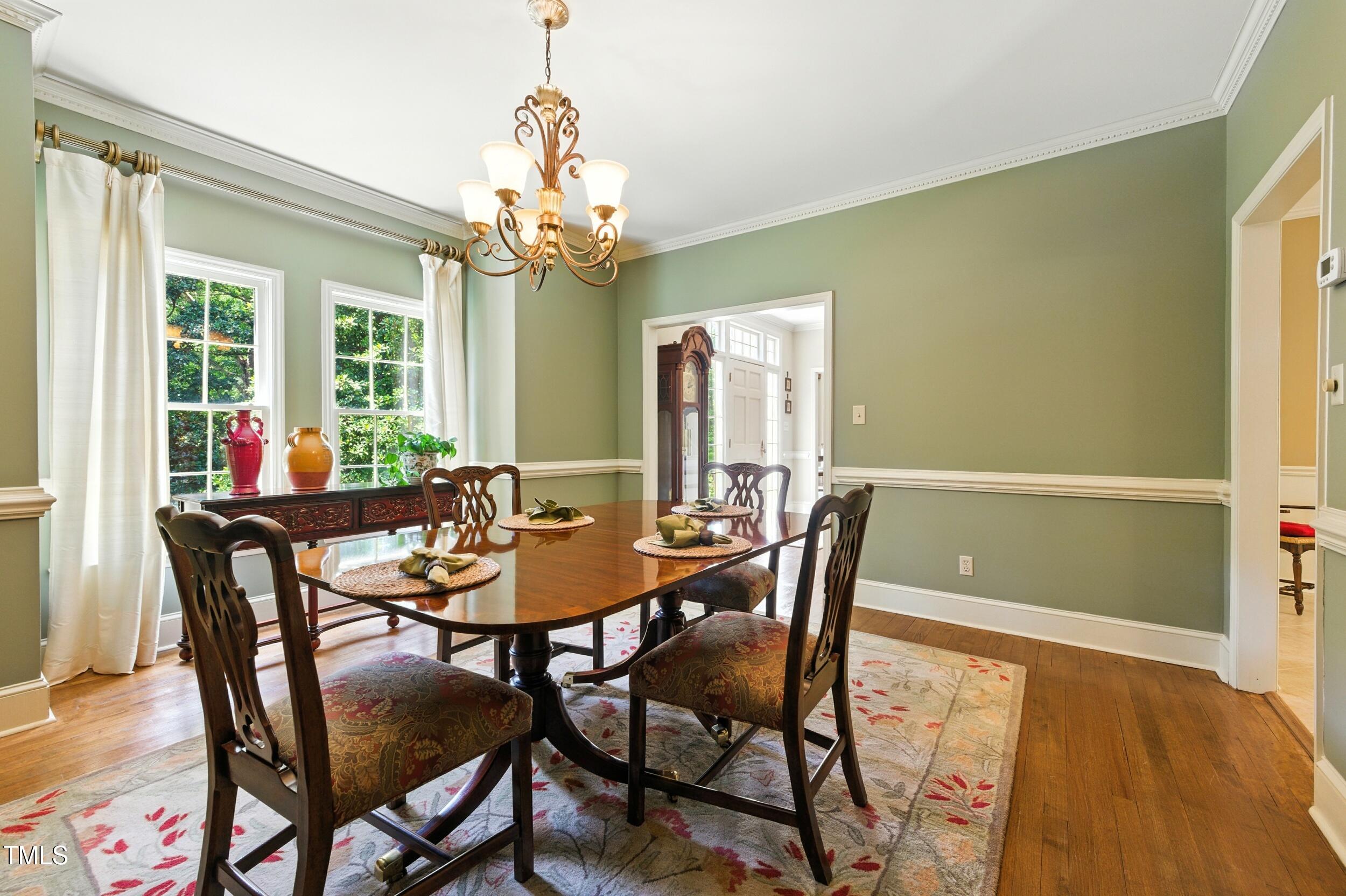 5317 Deep Valley Raleigh, NC 27606 - Photo 3 of 59 a view of a dining room with furniture and a chandelier