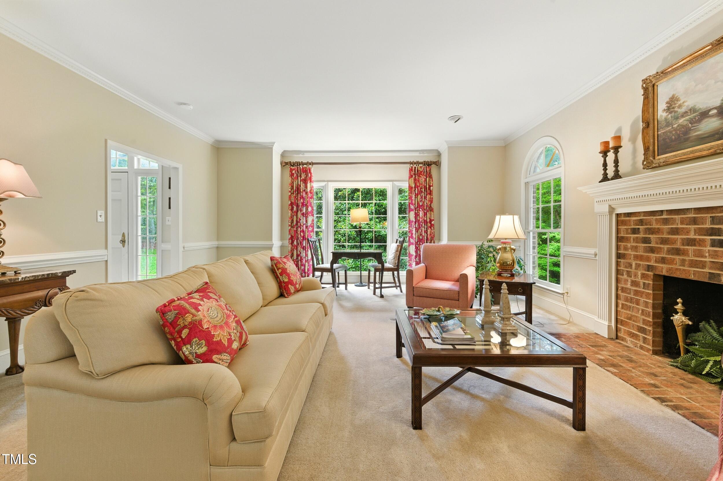 5317 Deep Valley Raleigh, NC 27606 - Photo 4 of 59 a living room with furniture and a fireplace