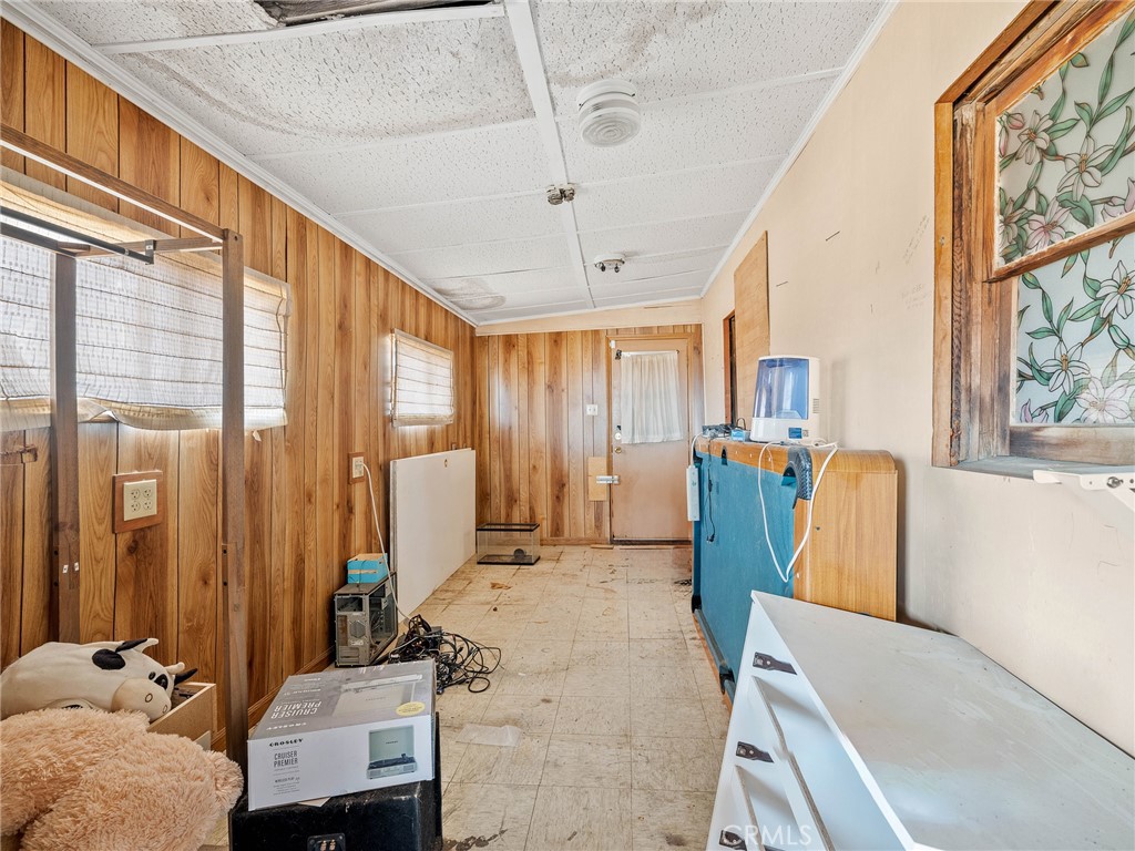 19876 Stoddard Wells Road Apple Valley, CA 92307 - Photo 23 of 40 a bedroom with furniture and a large window