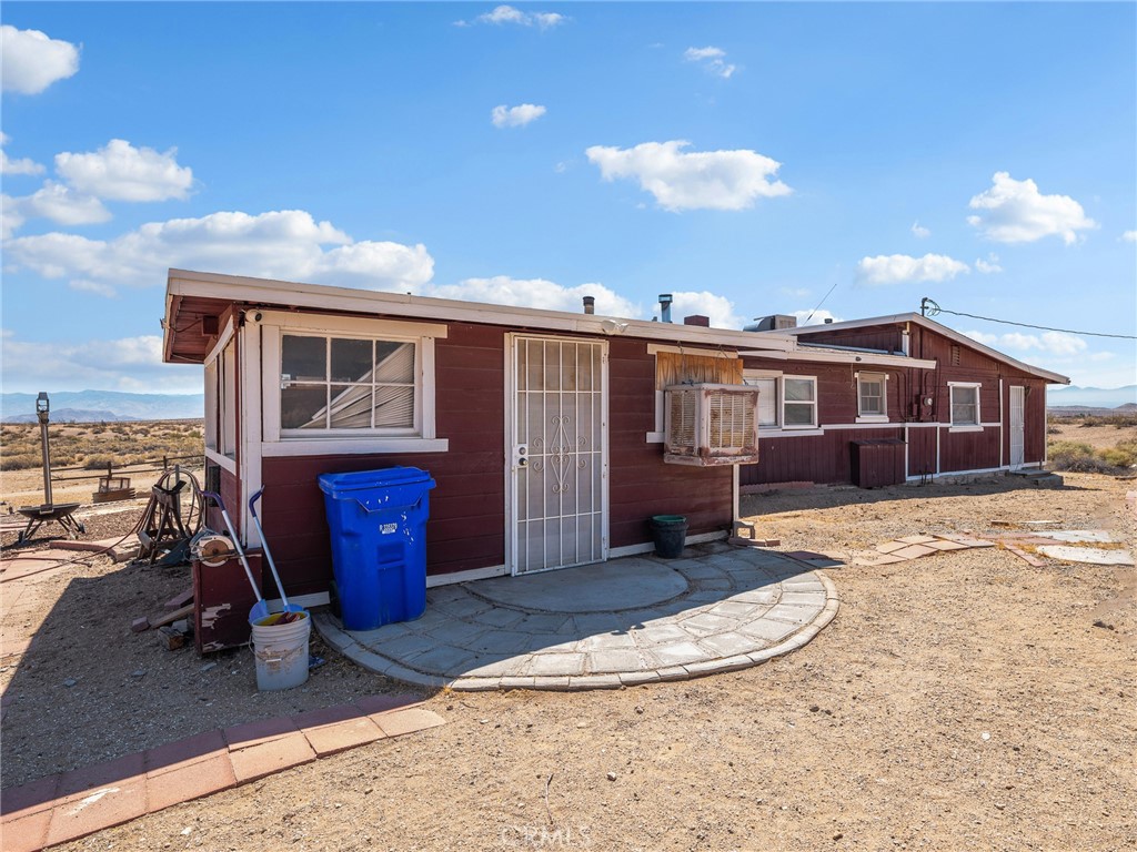 19876 Stoddard Wells Road Apple Valley, CA 92307 - Photo 29 of 40 a view of a house with a backyard