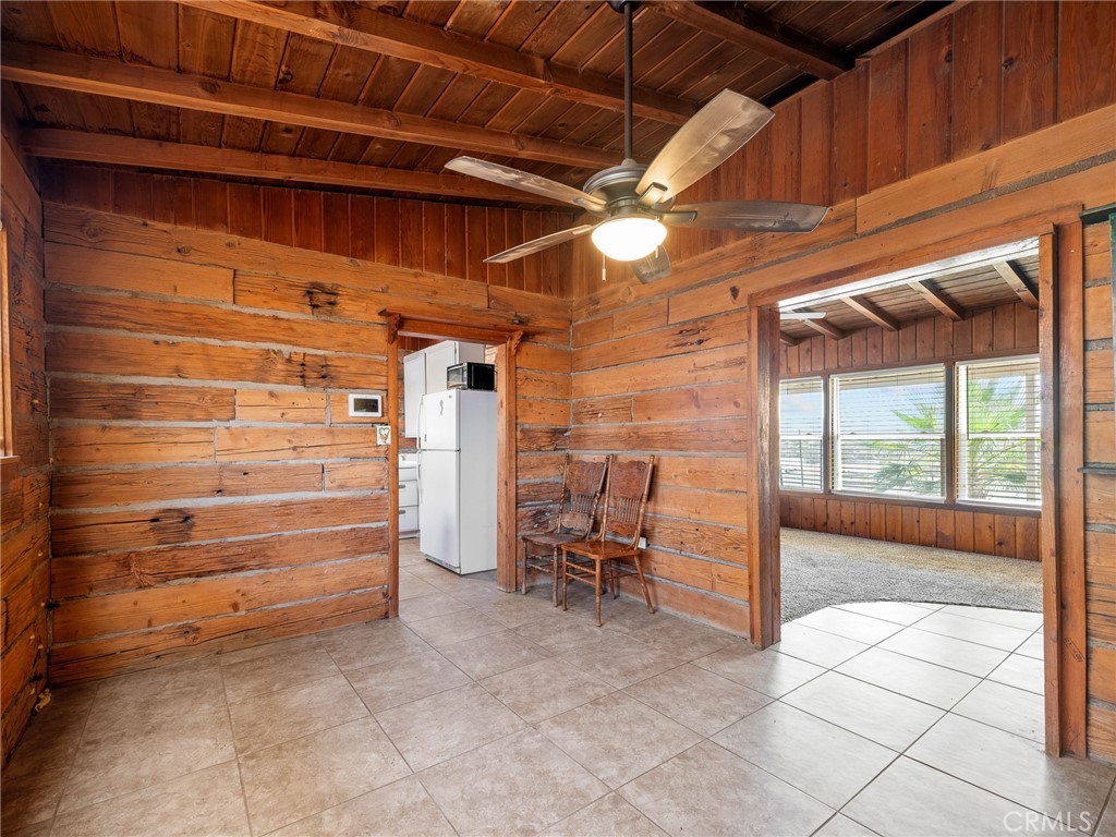 19876 Stoddard Wells Road Apple Valley, CA 92307 - Photo 9 of 40 a view of empty room with wooden floor and furniture