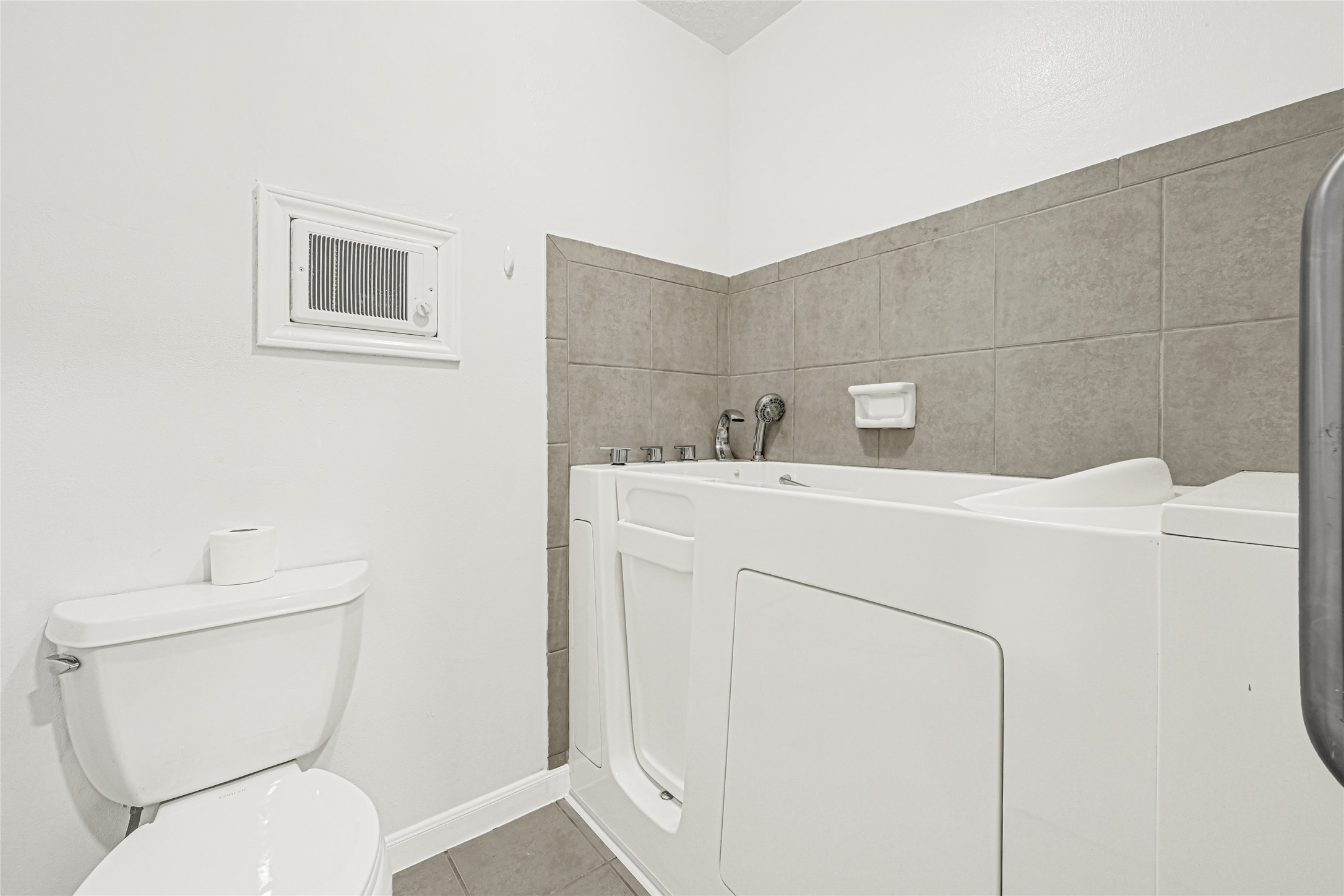 20135 Timber Line Lane New Caney, TX 77357 - Photo 23 of 30 a bathroom with a toilet sink and mirror