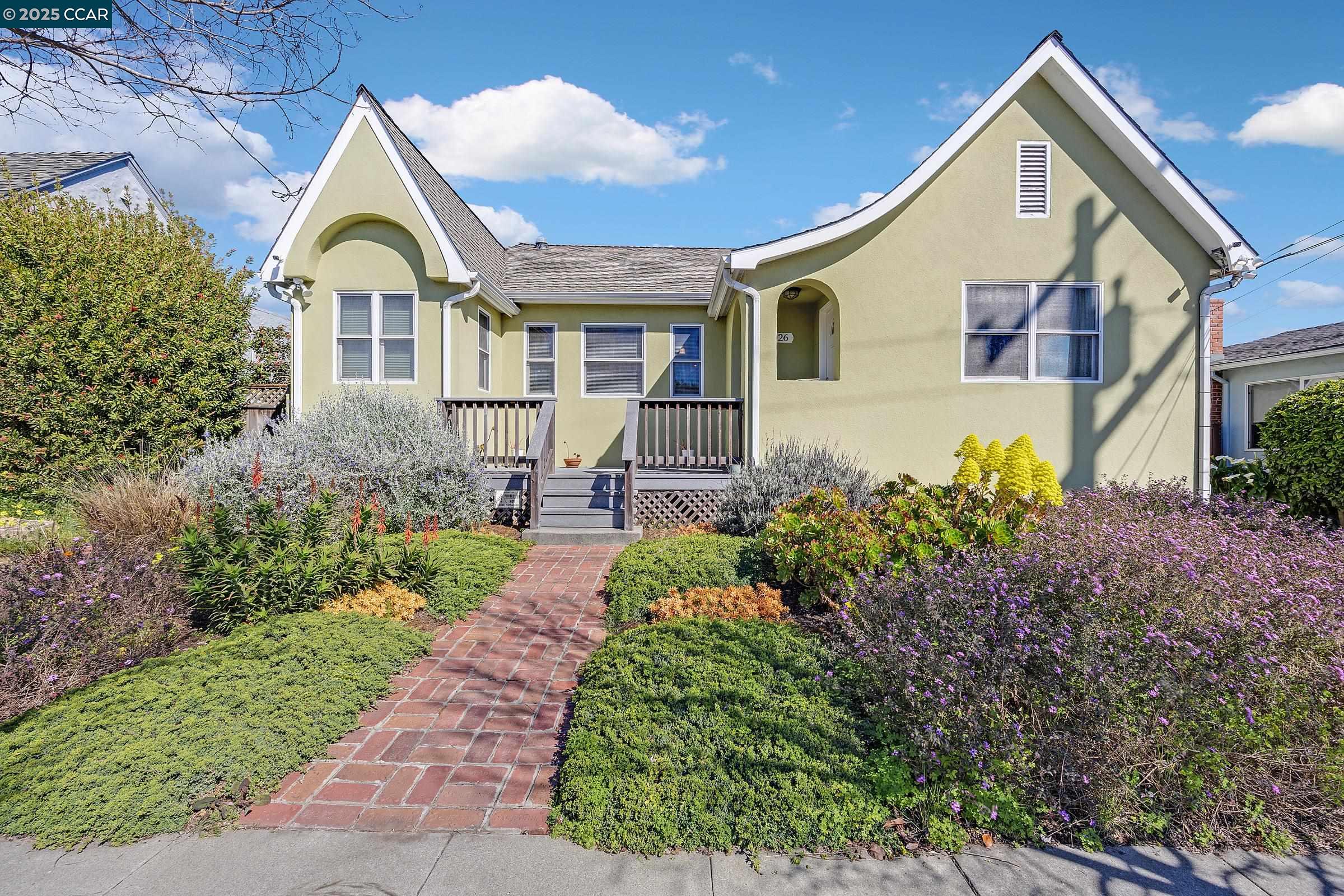 a front view of a house with garden