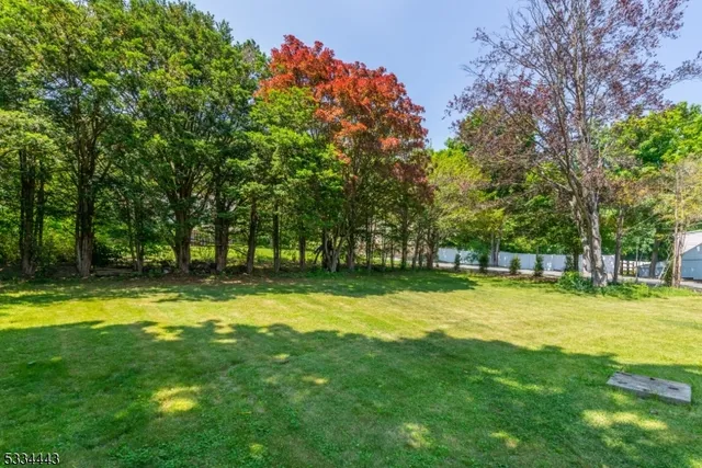 a view of swimming pool with trees in the background