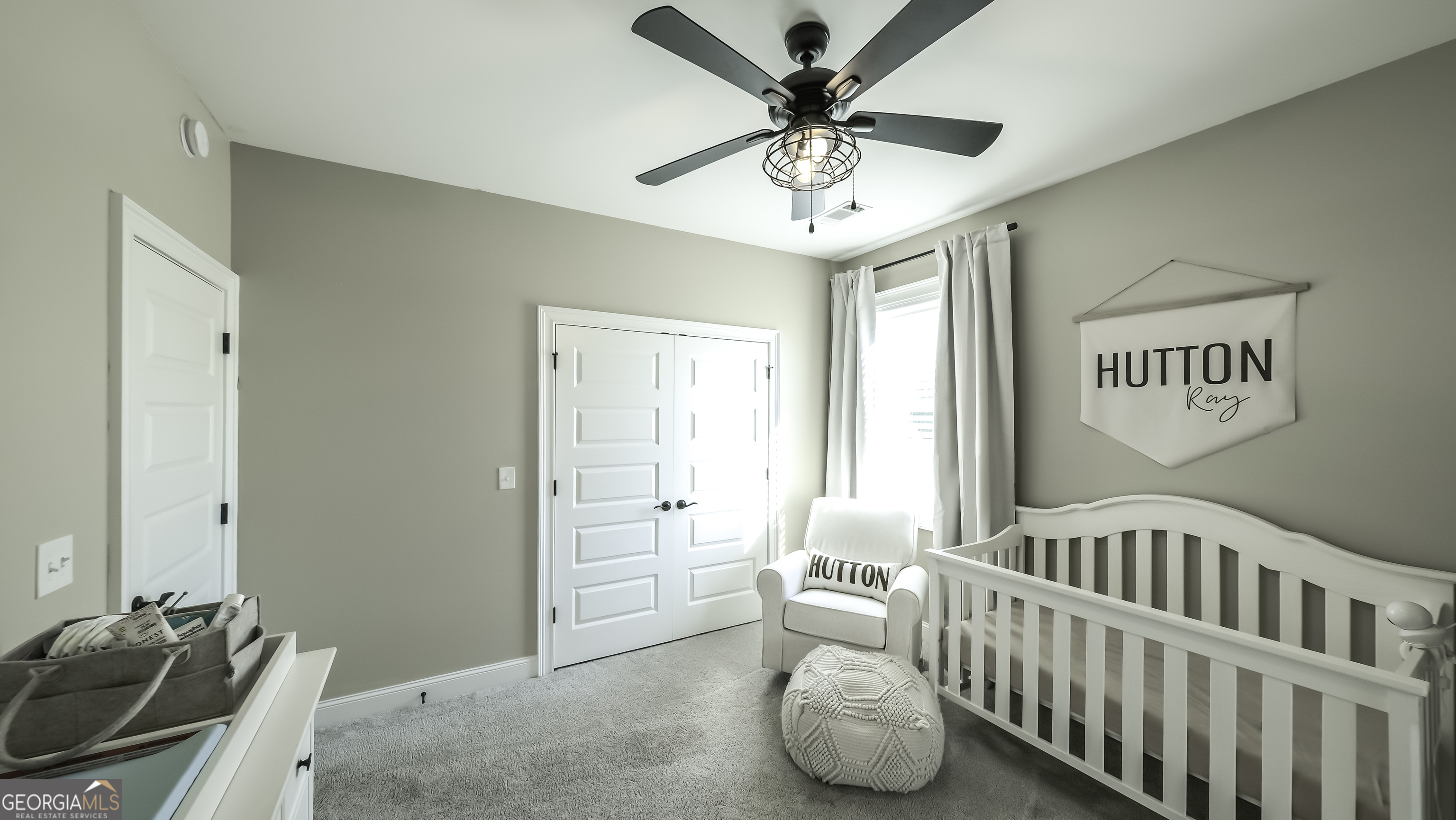 2392 Welcome Road Roopville, GA 30170 - Photo 36 of 43 a bedroom with furniture and a chandelier