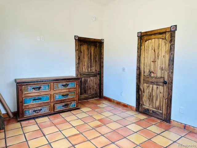 a view of front door with wooden floor