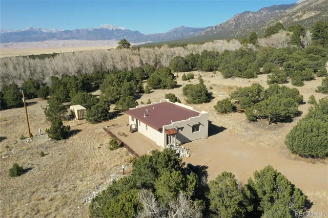 a view of a yard with a mountain