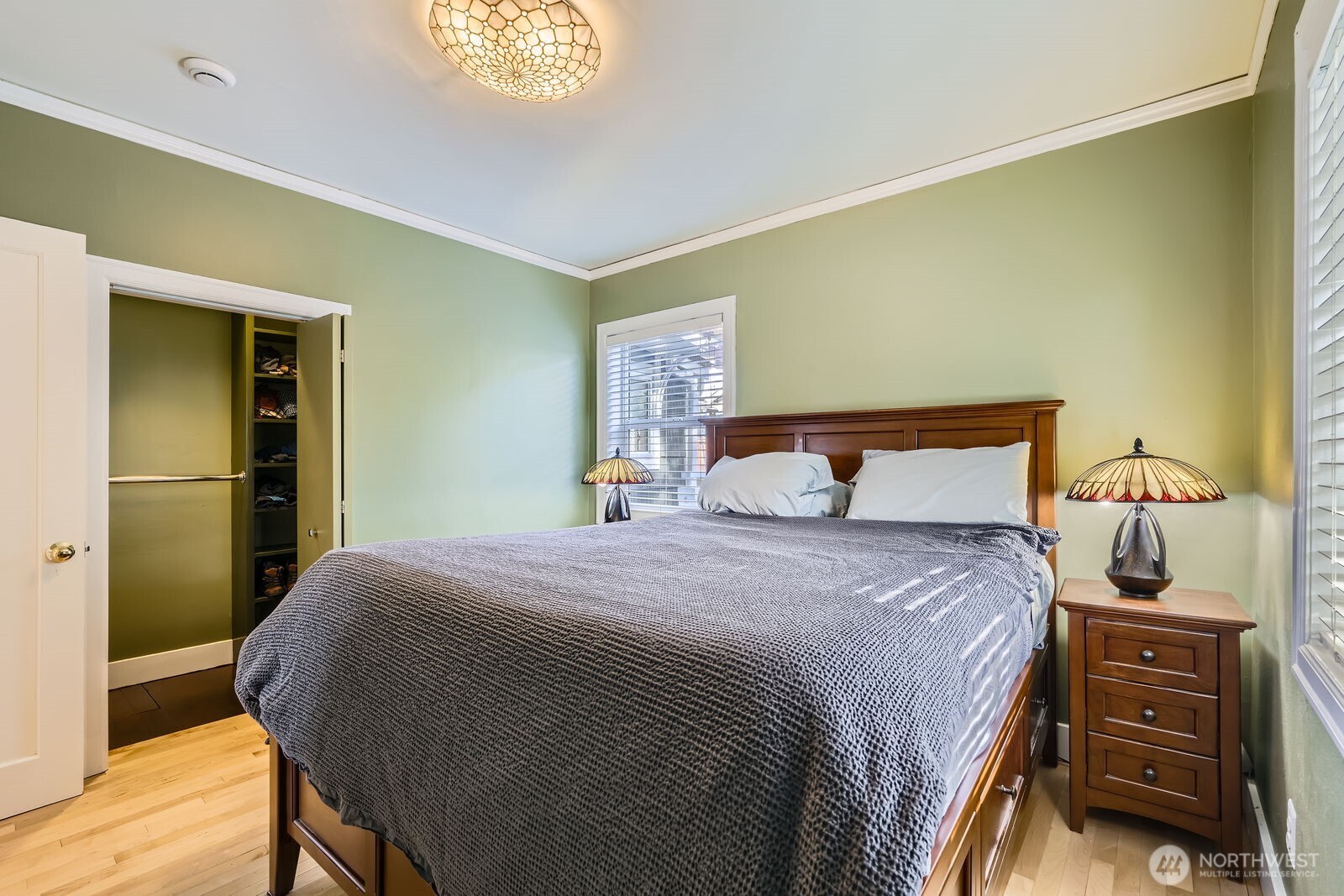 3630 46th Avenue Southwest Seattle, WA 98116 - Photo 11 of 29 a bedroom with a bed and a dresser