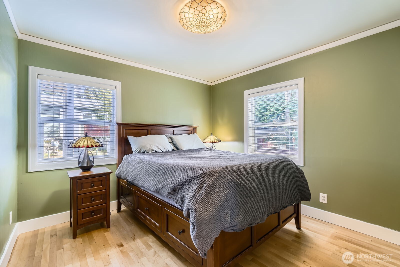 3630 46th Avenue Southwest Seattle, WA 98116 - Photo 12 of 29 a bedroom with a bed and a window