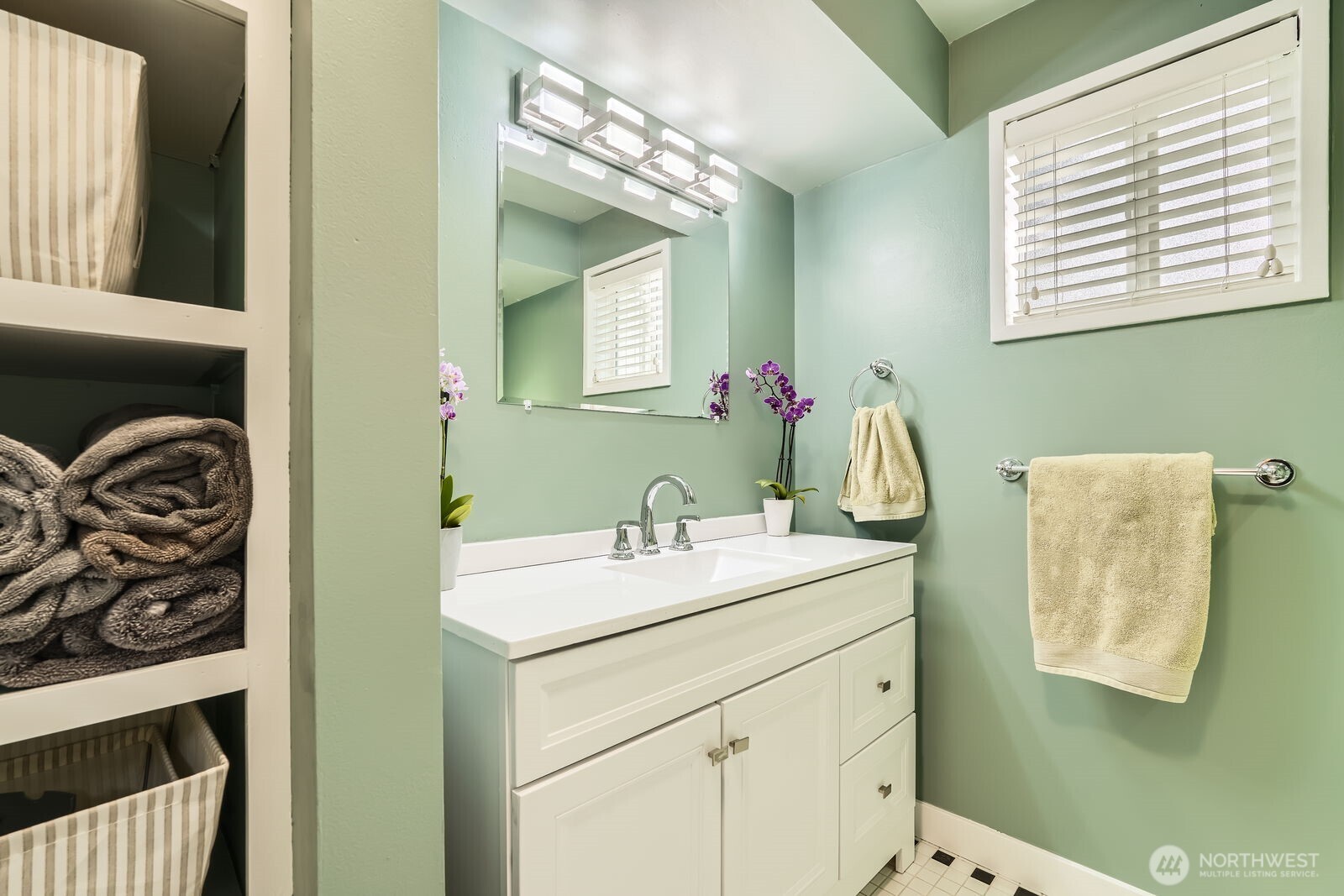 3630 46th Avenue Southwest Seattle, WA 98116 - Photo 13 of 29 a bathroom with a sink and a mirror