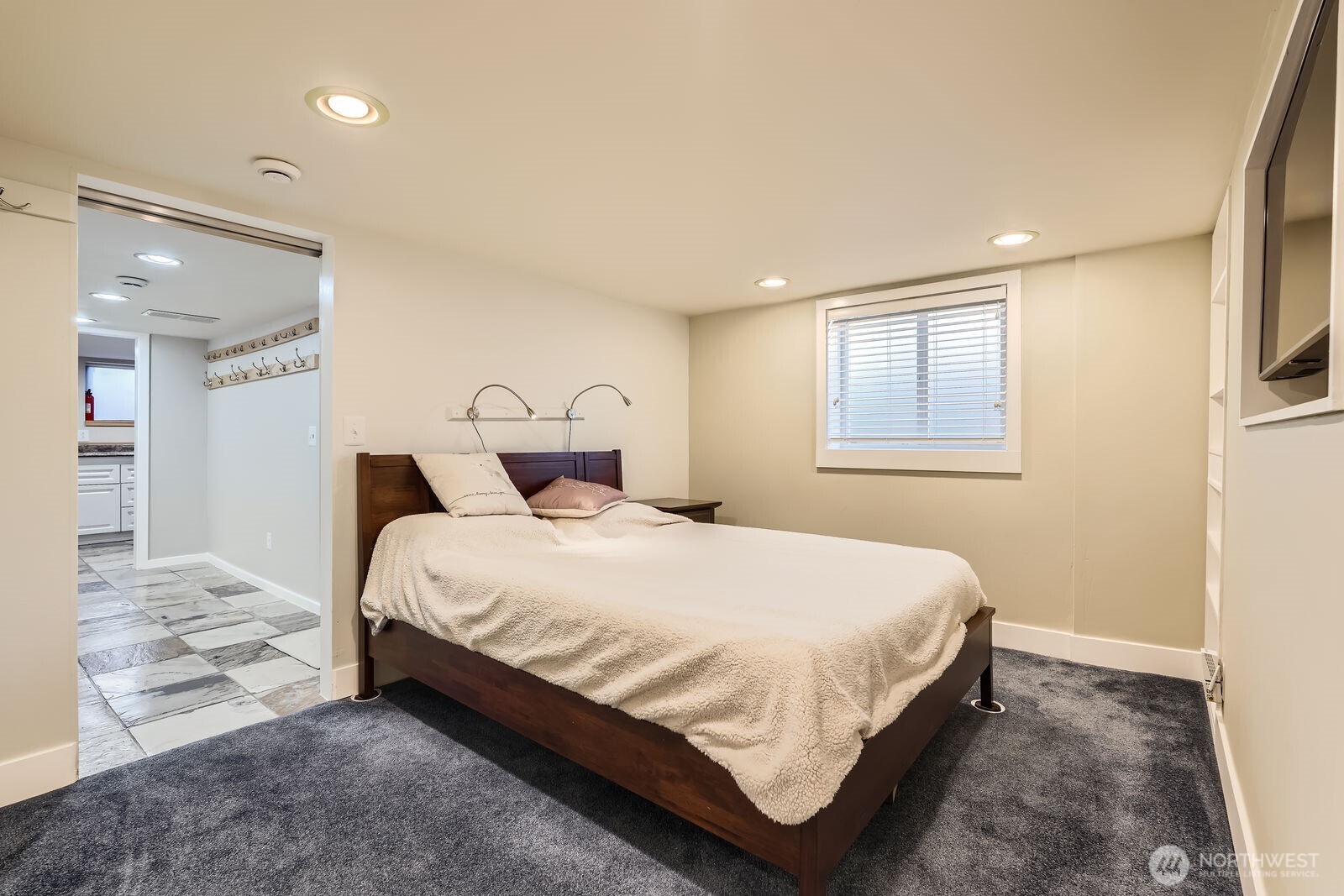 3630 46th Avenue Southwest Seattle, WA 98116 - Photo 18 of 29 a bedroom with a bed and a window