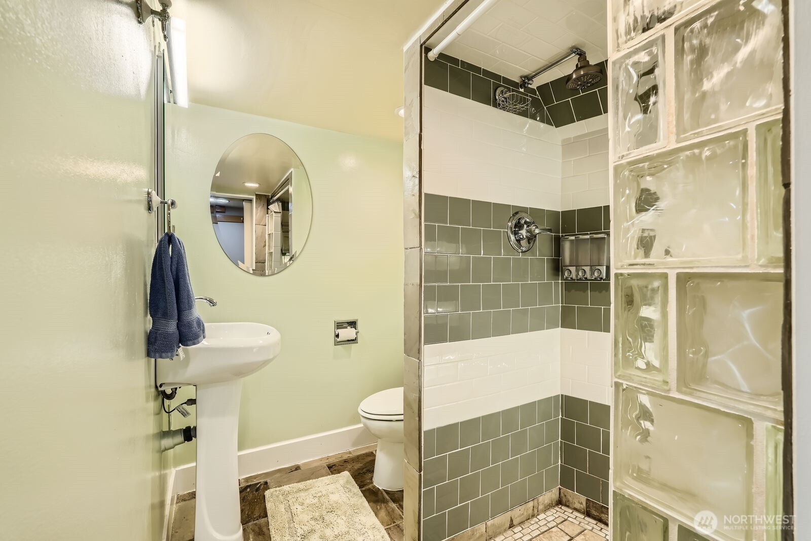 3630 46th Avenue Southwest Seattle, WA 98116 - Photo 19 of 29 a bathroom with a shower toilet and sink