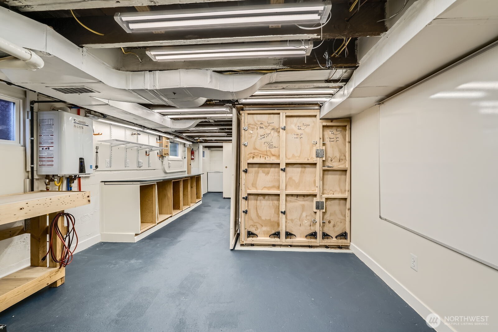 3630 46th Avenue Southwest Seattle, WA 98116 - Photo 20 of 29 a view of an empty room with racks on the wall