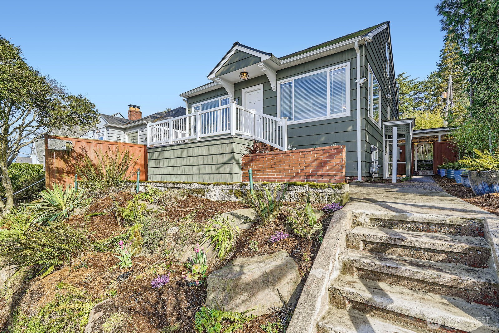 3630 46th Avenue Southwest Seattle, WA 98116 - Photo 2 of 29 a front view of a house with a yard