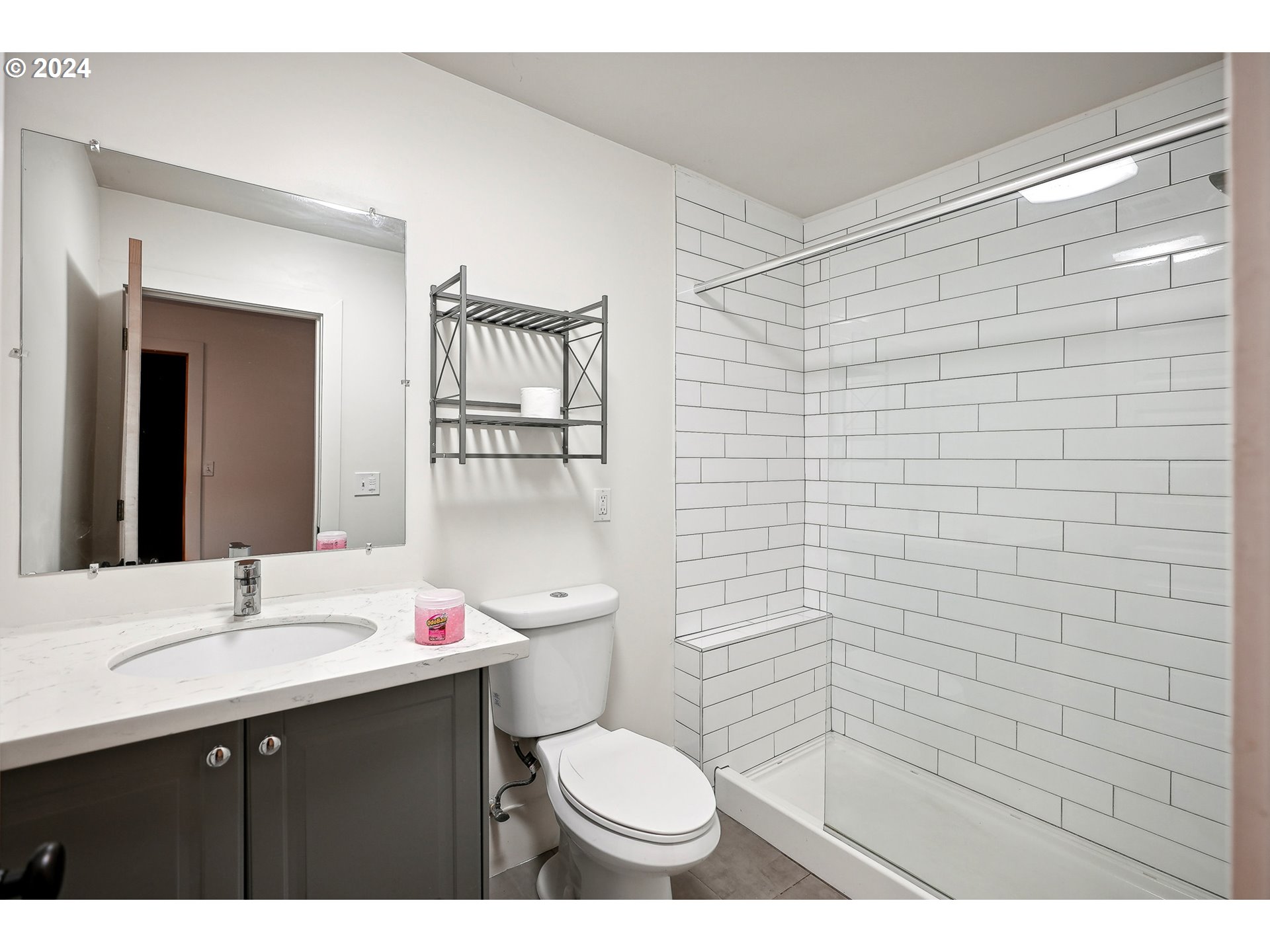 3903 North Michigan Avenue Portland, OR 97227 - Photo 14 of 47 a bathroom with a sink a toilet and mirror