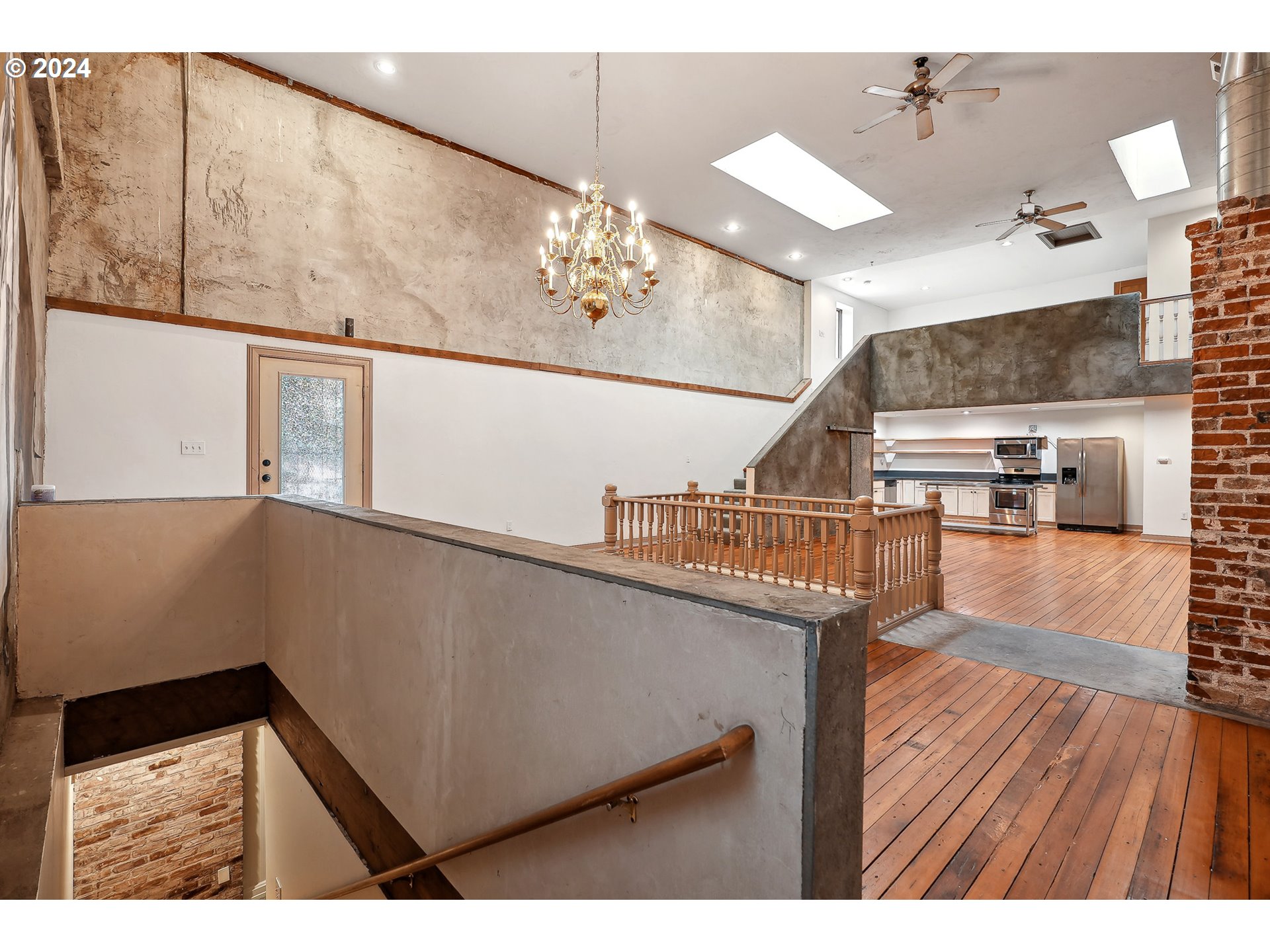 3903 North Michigan Avenue Portland, OR 97227 - Photo 9 of 47 a view of entryway and hall with wooden floor