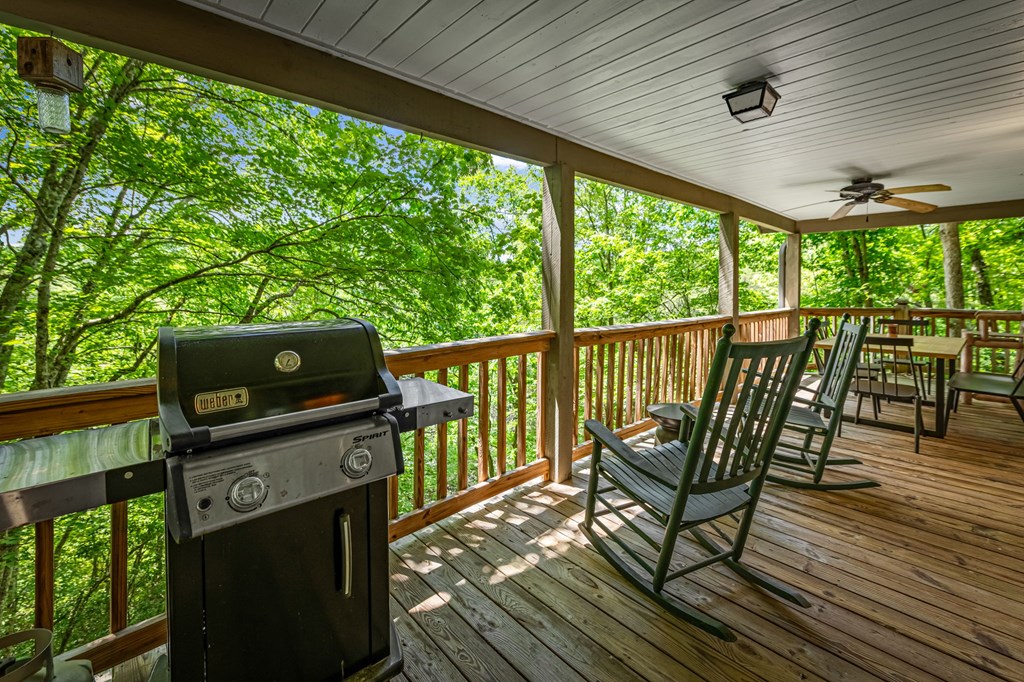 380 Branch Creek Road Blue Ridge, GA 30513 - Photo 38 of 41 a view of a chairs and table on the wooden deck