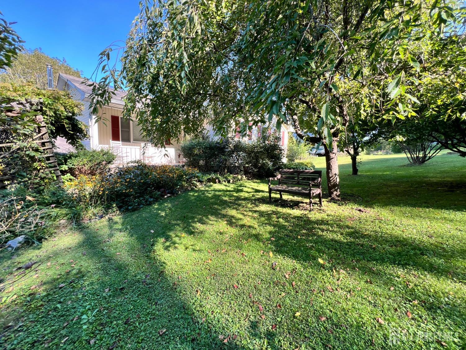 a view of a backyard with garden