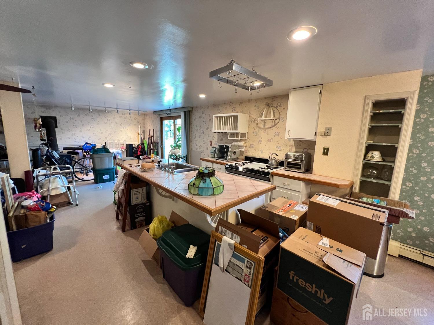 283 Rudetown Road Hamburg, NJ 07419 - Photo 20 of 38 a group of people sitting in a room with kitchen view