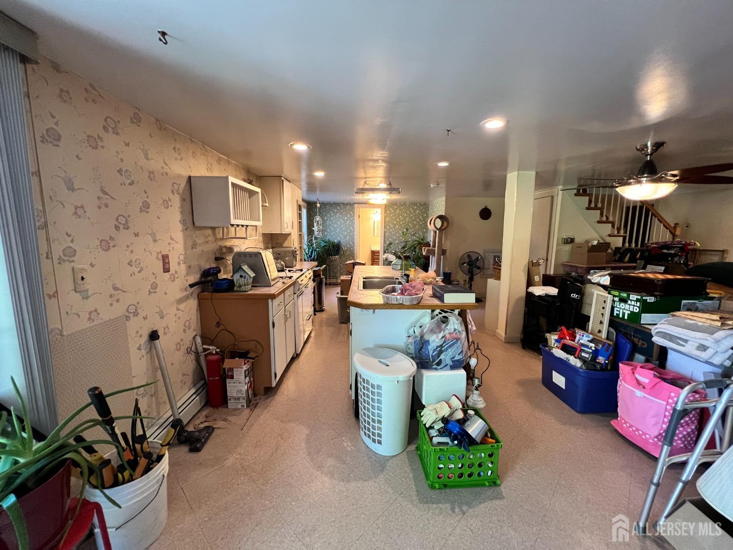 283 Rudetown Road Hamburg, NJ 07419 - Photo 21 of 38 a room with gym equipment and kitchen view