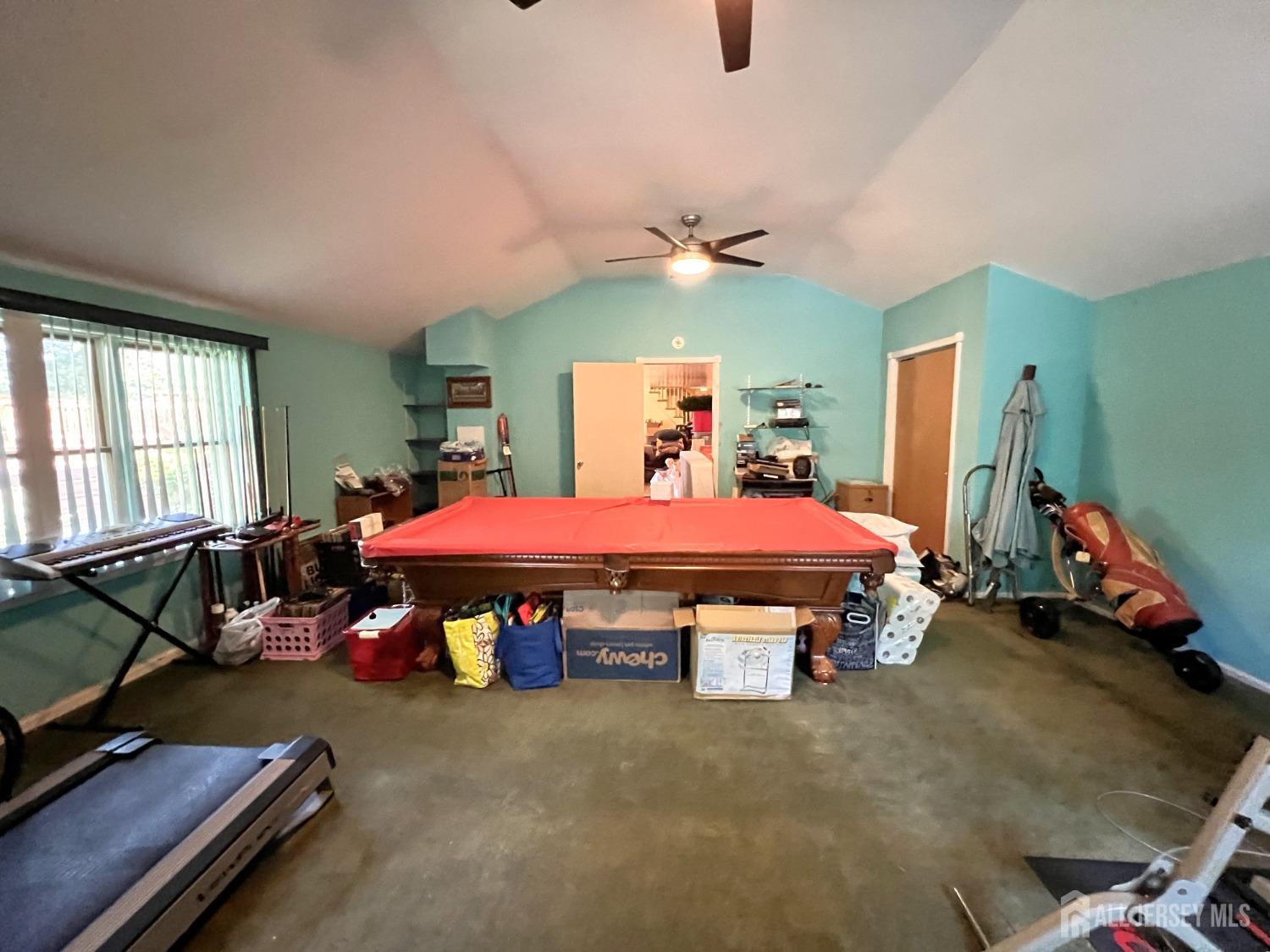 283 Rudetown Road Hamburg, NJ 07419 - Photo 23 of 38 a bedroom with a bed and a chandelier