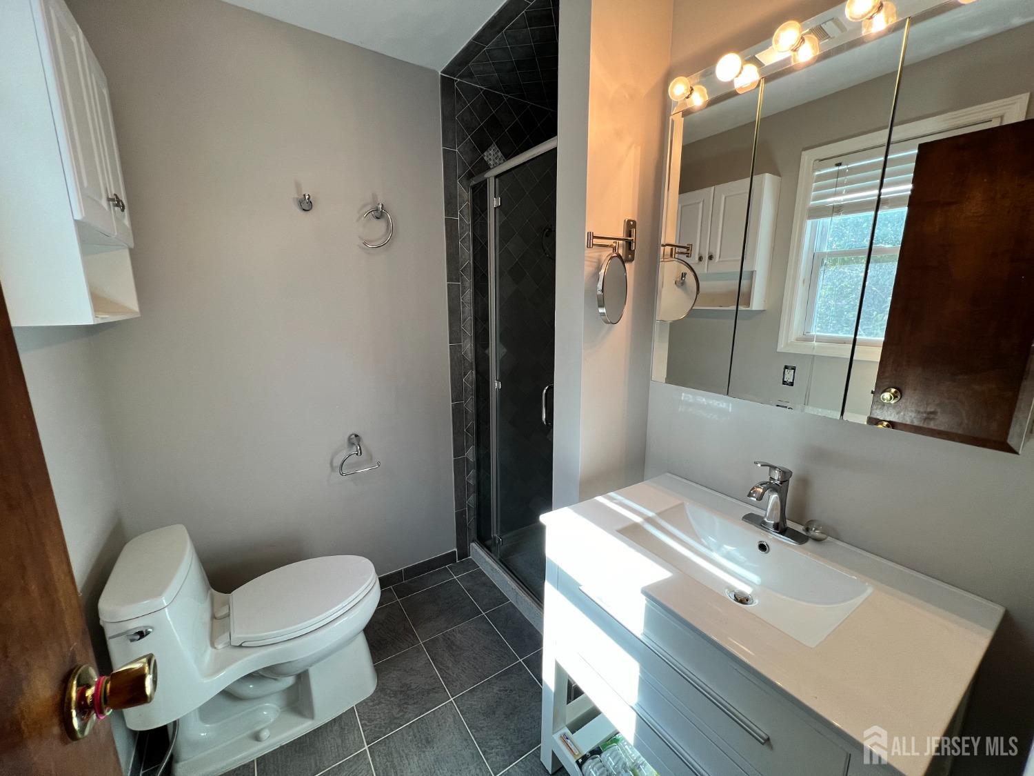 283 Rudetown Road Hamburg, NJ 07419 - Photo 25 of 38 a bathroom with a sink toilet and shower