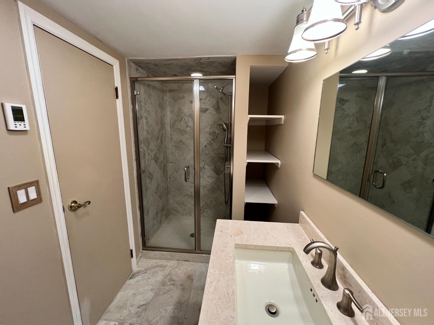 283 Rudetown Road Hamburg, NJ 07419 - Photo 27 of 38 a bathroom with a sink a toilet and shower