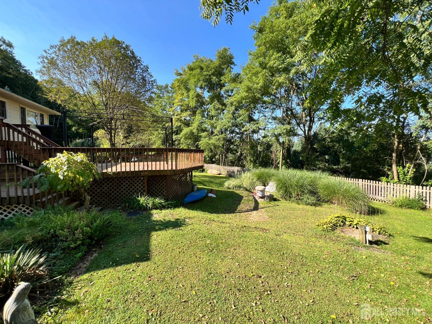 283 Rudetown Road Hamburg, NJ 07419 - Photo 32 of 38 a view of a garden with wooden fence
